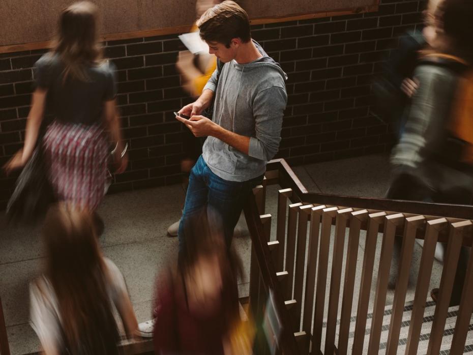 Student looking up information on his phone