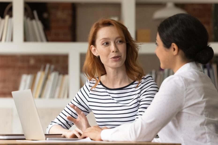 A tutor speaking to a student