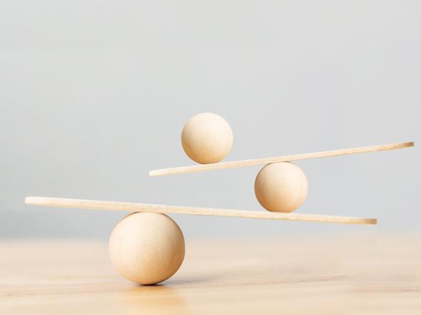 wooden balls balancing on slats