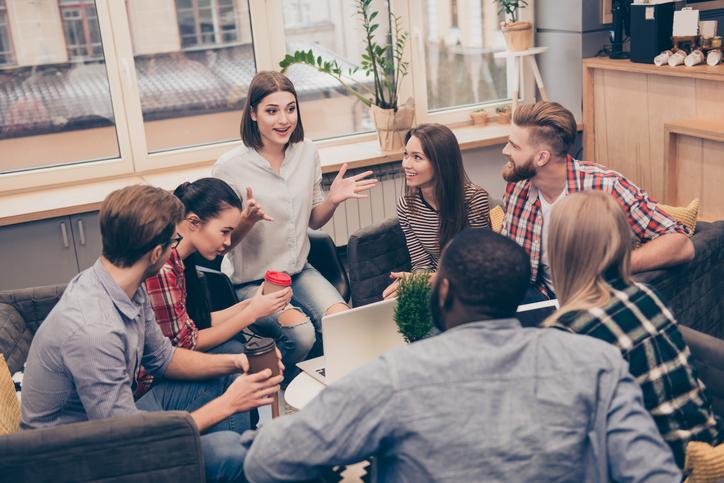 A group of students sitting in a group talking