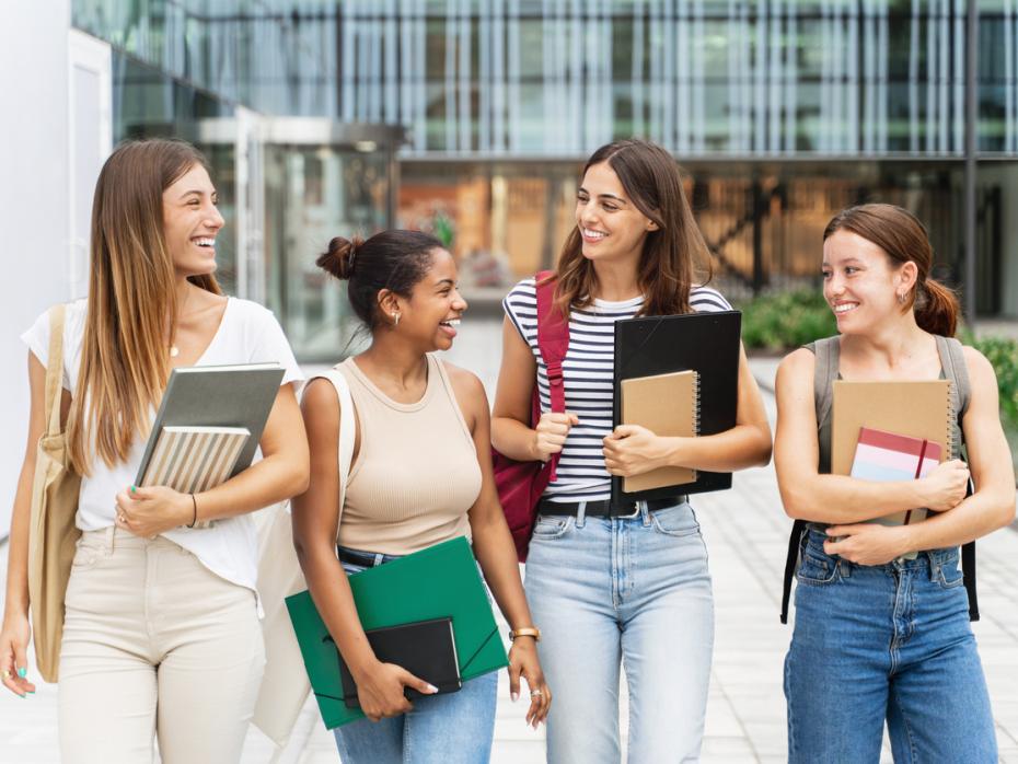 Students chatting outside a campus building