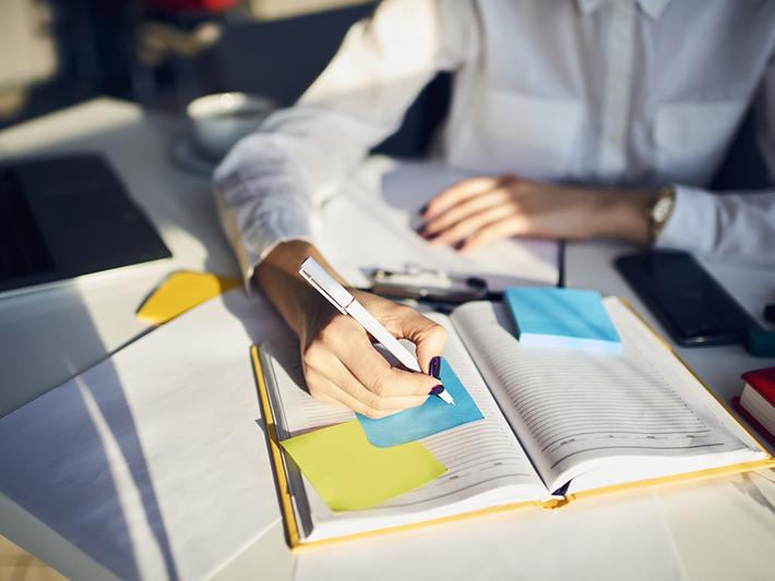 Young woman planning work schedule