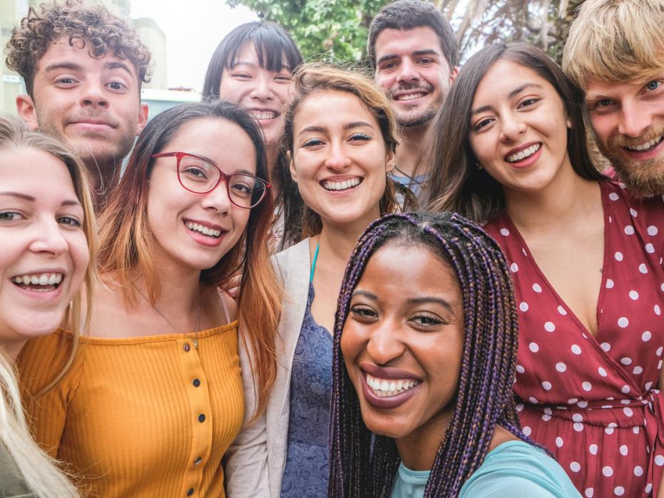 A group of multicultural students smiling to camera