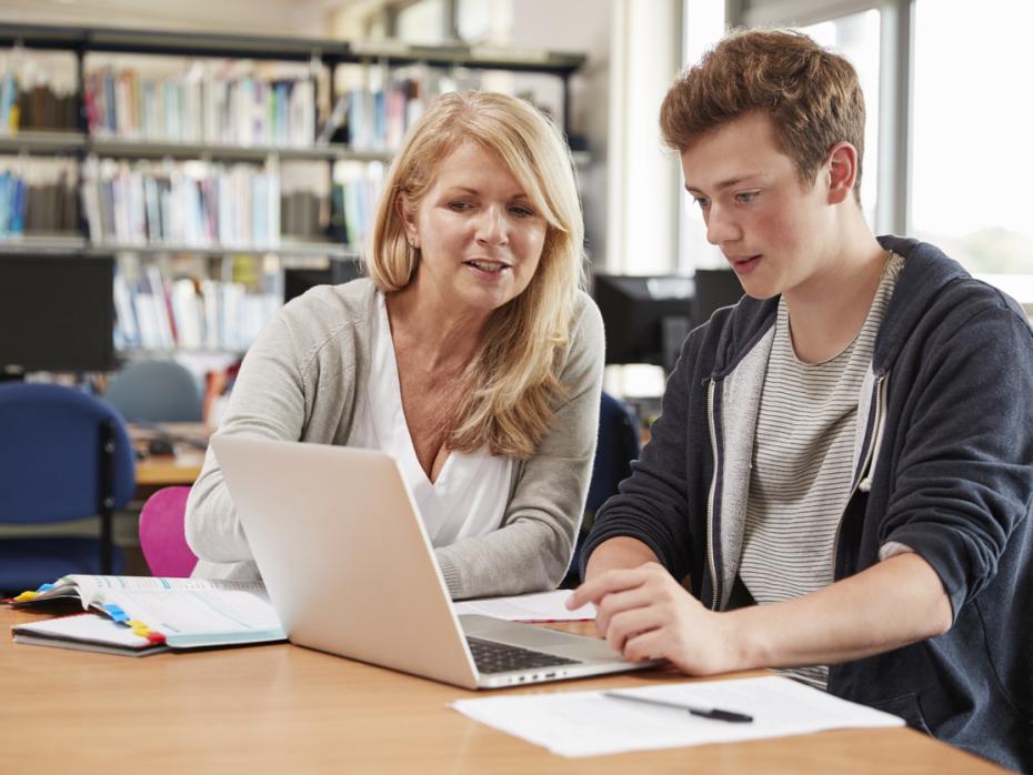 Student receiving guidance from a teacher