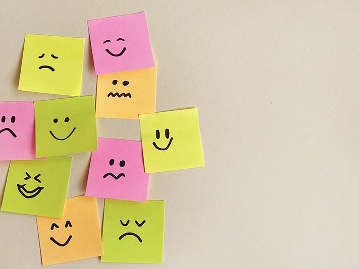 Post-it notes showing smiling and frowning faces