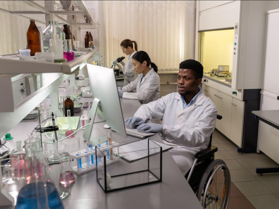 Black and Asian researchers working in a lab