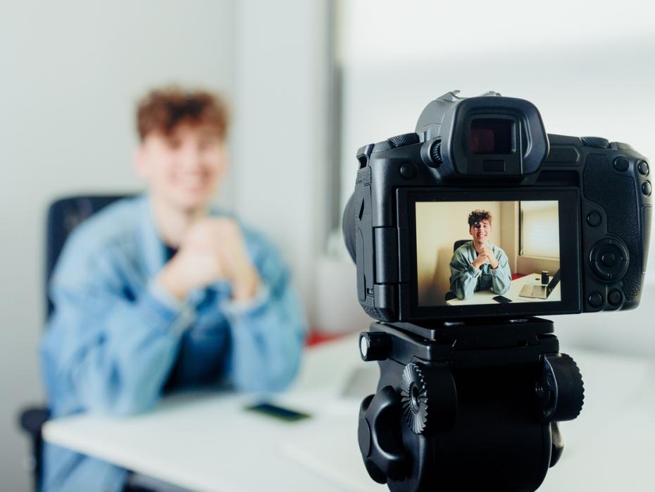 A student filming himself speaking to camera