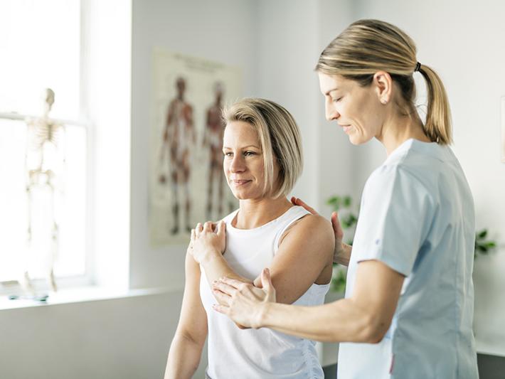 Physical therapist treating patient