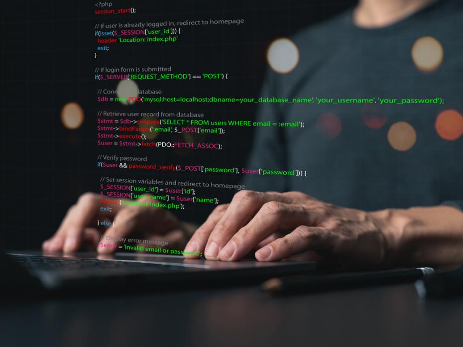 A computer science studeng coding on her laptop