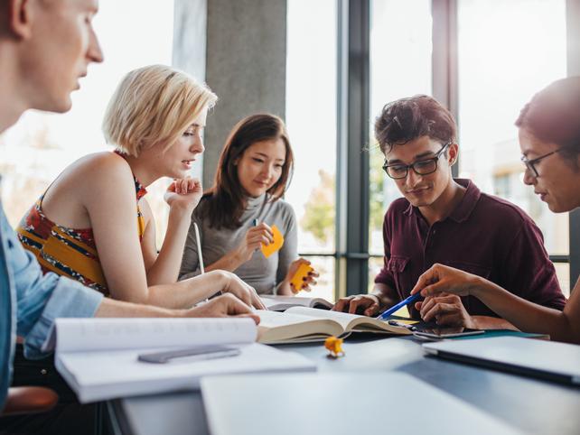 Academics work together around a table