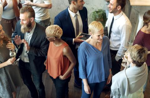 Men and woman chatting at a networking event