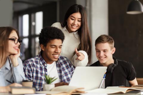 Students working together at a laptop