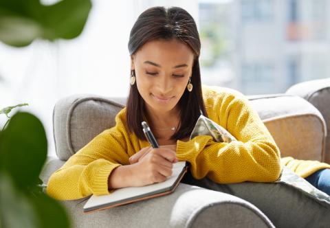 A teacher writing in her journal