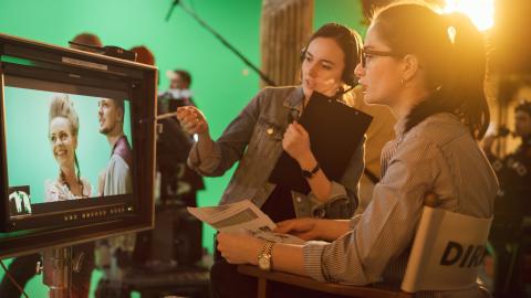 Female director supervising a film shoot