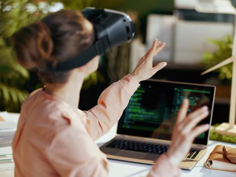 A professional uses a VR headset while working