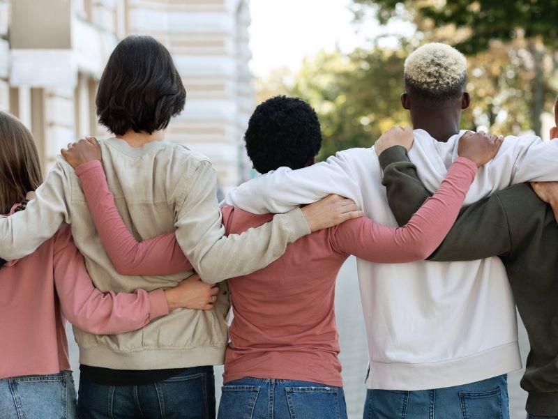 Image of students arm in arm forming a united front