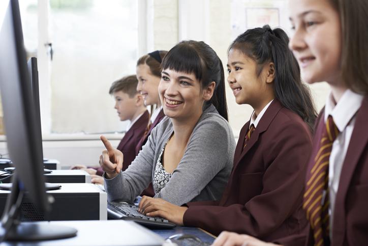 University student teaching secondary school students