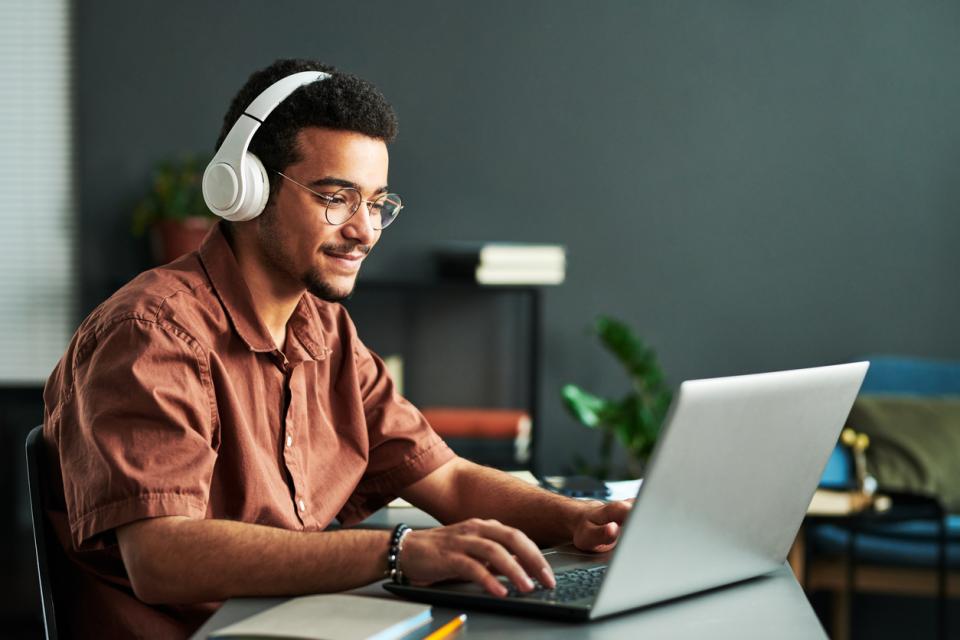 A man working in large headphones