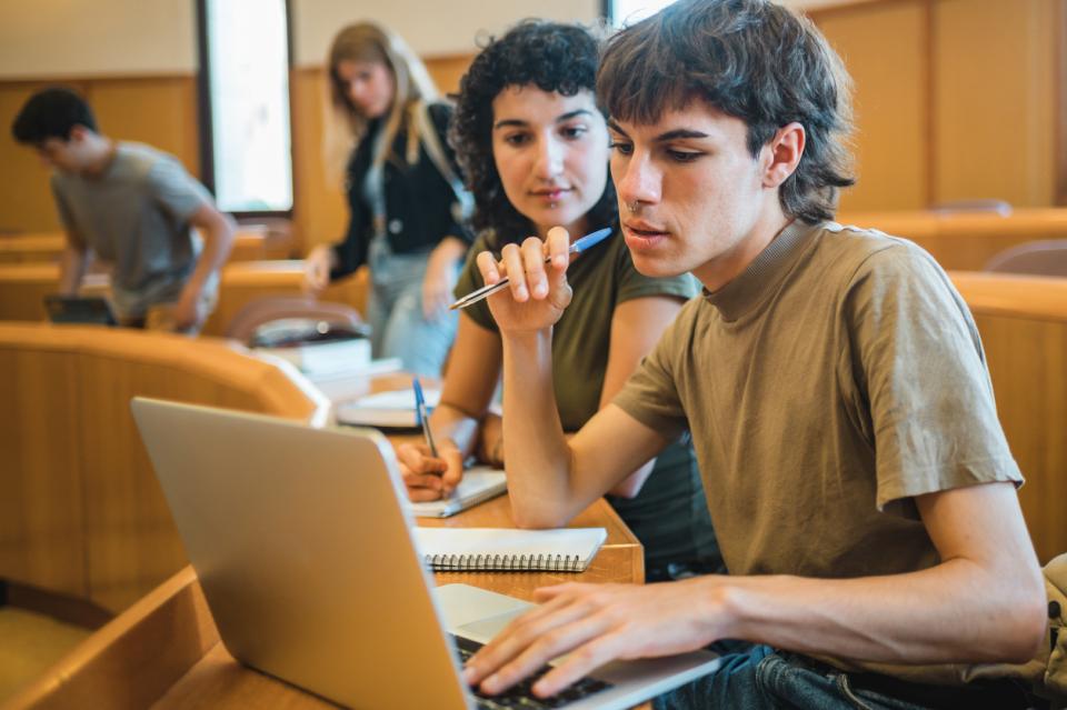 Students working at their laptops