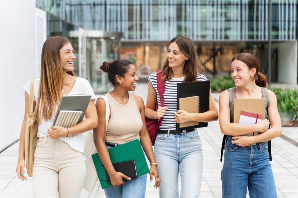 Students chatting outside a campus building