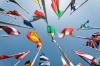 A range of international flags, shot from below