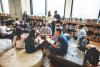 A group of students chatting in a study area