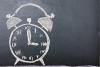 Clock drawn on blackboard, time management